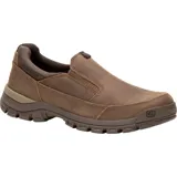 Zapato Caterpillar Threshold Slip On de cuero color marrón, sin cordones, con elástico en la parte superior y suela de goma.