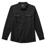 Camisa de franela negra con dos bolsillos frontales con solapa abotonada, corte recto y cierre frontal con botones.