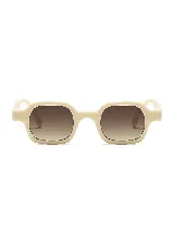 Lentes de sol modelo Cabo Cartagena, con armazón de acetato color crema y cristales degradados en tonos marrones.
