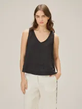 Top holgado de lino azul con escote en V y sin mangas.