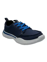 Championes Hush Puppies modelo Alfie Lace, color azul marino con cordones en azul brillante y suela de goma EVA blanca. Presentan un diseño de tela con costuras reforzadas en la puntera y tecnología de confort en la plantilla.