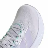 Championes Adidas Questar 4 W para running, color lila con detalles en verde lima y suela blanca.