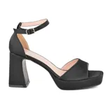 Sandalias de vestir negras con plataforma y tacón cuadrado alto. Tira delgada al tobillo con hebilla ajustable.