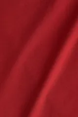Vestido mini de manga larga en punto elástico color bordó, con escote cruzado en V, corte ajustado y frunces laterales que crean un efecto drapeado.