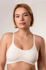 Top maternal de microfibra sin costuras, con diseño sin aros ni copas. Cuenta con broches desmontables en los breteles para facilitar la lactancia y breteles regulables.