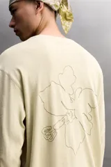 Remera manga larga Zara Athleticz de color beige, con cuello redondo y costuras visibles en los hombros.