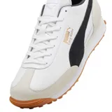 Championes Puma modelo Easy Rider Mix, en color blanco con detalles en negro, gris claro y suela de goma marrón con tacos. Cuenta con la franja característica de la marca en el lateral y el nombre en tono dorado.