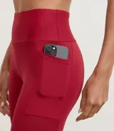 Legging deportiva Get Over de tiro alto, confeccionada en microfibra elástica, con bolsillos laterales funcionales y largo hasta el tobillo.