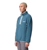 Buzo polar de cuello alto con cierre de botones a presión, manga larga y bolsillo frontal con cremallera en el pecho. Presenta un diseño retro con detalles en contraste en el cuello y la solapa.