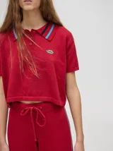 Pantalón de tiro alto, corte holgado y pierna ancha, confeccionado en algodón color beige. Presenta una franja lateral en contraste y cintura elástica con cordón ajustable.