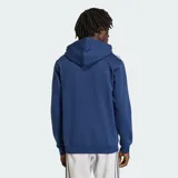 Canguro Adidas Originals de color azul, con capucha ajustable mediante cordones, bolsillo frontal tipo canguro y las icónicas tres rayas blancas en las mangas. Presenta el logo del trébol bordado en el pecho.
