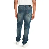 Pantalón de jean CAT para hombre, corte slim, color azul stone lavado, con cinco bolsillos y logo CAT en la parte trasera. Confeccionado en algodón, poliéster y spandex.