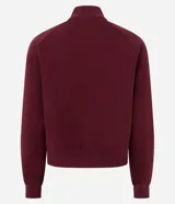 Buzo de algodón con felpa, de corte estructurado y diseño cropped. Presenta cuello alto con medio cierre frontal, mangas largas con puños elásticos y ruedo con elástico ancho.