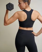 Calza larga negra, modelo chupín, de tiro alto. Confeccionada en algodón y licra opaca, presenta una faja doble tela sin elástico superior para mayor sujeción.