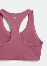 Top deportivo de diseño racerback, con escote redondo y banda elástica inferior para mayor soporte.