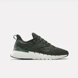 Championes de entrenamiento Reebok Nano Gym, color verde militar con suela blanca y detalles en negro.