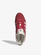 Zapatillas Adidas Tokyo color bordó con las tres tiras laterales en rosa pastel.