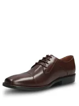 Zapato de vestir formal Hush Puppies modelo Jazz, confeccionado en cuero vacuno color marrón con diseño de puntera reforzada y cierre mediante cordones.