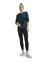 Calza deportiva negra con cintura elástica alta y cordón ajustable exterior. Cuenta con bolsillos laterales y diseño ajustado.