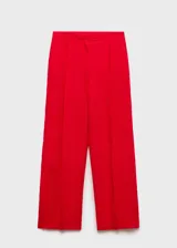 Pantalon de vestir de corte recto y tiro medio, confeccionado en lino con forro de algodón. Presenta cierre frontal oculto con botón, gancho y cremallera, además de bolsillos laterales.