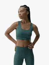 Top deportivo de sujeción media con escote redondo y espalda abierta con tirante fino. Confeccionado en tejido ligero y resistente con estampado abstracto de efecto acuático.