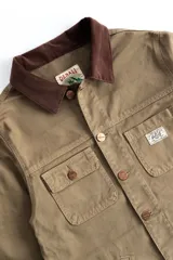Campera corta de jean verde con cuello marrón, confeccionada en jean grueso 100% algodón.