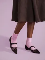 Medias de caña media color rosa claro.