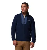 Campera de polar Columbia con cierre frontal completo, cuello alto y bolsillos laterales con cierre. Presenta un panel frontal superior en tejido superpuesto de distinto tono y logo de la marca bordado en el pecho.