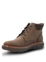 Botín de cuero color marrón con ajuste a cordones, cuello acolchado en tono oscuro y suela tecnológica Spinal Flex para mayor amortiguación y estabilidad.