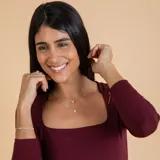 Conjunto de dos collares con dije punto de luz en plata 925 y circonia, con cadena de eslabones finos.