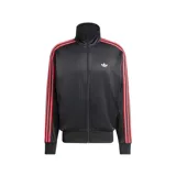 Campera deportiva Adidas modelo Firebird Pinstripes, de color negro con sutiles rayas verticales y detalles de tiras rojas y blancas en las mangas. Cuenta con cuello alto, cierre frontal completo y el logo del trifolio bordado en el pecho.