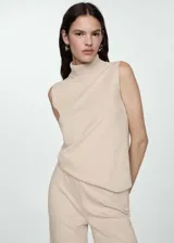 Pantalón wide leg de tejido de punto color beige, con cintura elástica y diseño largo.