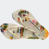 Ojotas Havaianas Slim Summer Bliss con estampado floral multicolor y tiras finas color verde oscuro.