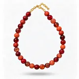 Collar corto de esferas en resinas italianas exclusivas en tonos bordó y rojo, con cierre metálico dorado.