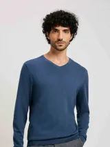 Sweater azul de tejido de punto con escote en V y mangas largas.