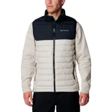 Chaleco Columbia Powder Lite II para hombre, con diseño bicolor en negro y beige. Presenta cierre frontal completo, cuello alto con protector de barbilla y bolsillos laterales con cierre. Cuenta con tecnología de aislamiento térmico y acabado resistente al agua.