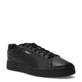 Championes Puma Court Classico de color negro, con diseño urbano de inspiración deportiva, capellada sintética, cordones negros y detalles de la marca en dorado.