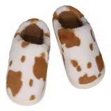 Pantuflas sin talón confeccionadas en algodón afelpado y piel sintética, con divertido estampado de manchas de vaca en tonos blanco y marrón, y suela de PVC.