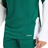 Buzo de entrenamiento Adidas Tiro para la selección de fútbol de Italia, color verde oscuro con mangas blancas y detalles en dorado. Presenta cuello alto con cierre parcial (quarter-zip), logo de Adidas y escudo de Italia en el pecho. Posee las tres franjas de Adidas en los hombros en dorado y blanco.
