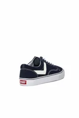 Championes deportivos Pony modelo Garden, color azul marino con el característico logo lateral en blanco y cordones blancos. Suela de goma blanca con línea negra.