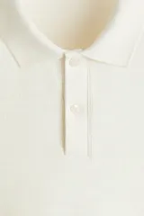 Remera polo de manga larga H&M en punto jacquard de mezcla de algodón, con cuello clásico, tapeta con botones y corte ajustado.