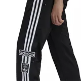 Pantalón deportivo Adidas Adibreak negro con tres rayas blancas a los costados y logo en la pierna.