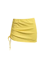 Minifalda amarilla de lycra texturizada, con cintura elástica y cordón lateral ajustable.