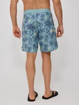 Short de baño Rusty con estampado de motivos botánicos y puntos amarillos sobre fondo azul. Cuenta con cintura elástica con cordón de ajuste y bolsillo lateral.