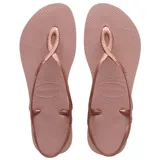Ojotas Havaianas modelo Luna, color rosado metalizado, con tiras finas que se cruzan y forman un lazo en el empeine, y tiras traseras ajustables.