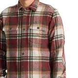 Camisa de manga larga con diseño a cuadros en tonos bordó, beige y verde. Presenta cuello clásico, cierre frontal con botones y dos bolsillos en el pecho con solapa.