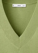 Jersey de punto color verde claro, con escote en V y mangas largas de corte holgado.