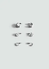 Pack de tres pares de aros pequeños plateados de diseño combinado en metal.