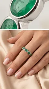 Anillo de plata 925 con diseño de medio sin fin, engastado con piedras naturales de esmeralda en corte ovalado.