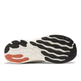 Championes de running New Balance Fresh Foam X 1080, color gris claro con detalles en negro y celeste.